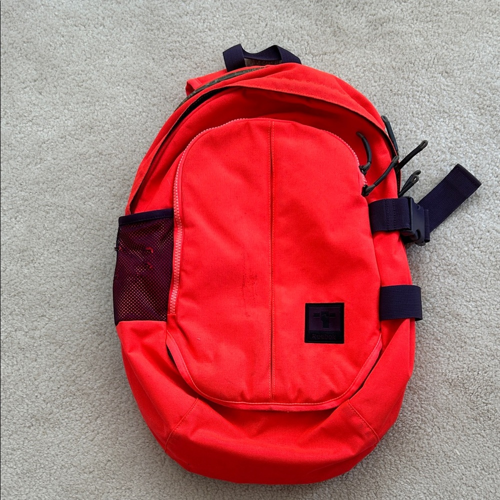 Reebok Bold Orange Backpack with Purple Accents
